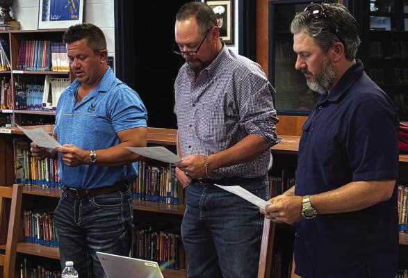 Windthorst ISD board members left to right: Cody Geis, Shawn Price and Clay Conrady take their oath of office during the board meeting on Monday, May 12. Photo/Nathan Lawson