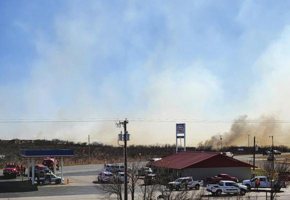 Law Enforcement and Fire Department officials set up at the Kamay Y Convenience Store as Volunteer Fire Departments fight a large fire in the northwestern portion of Archer County. Courtesy photo/Justin McBride