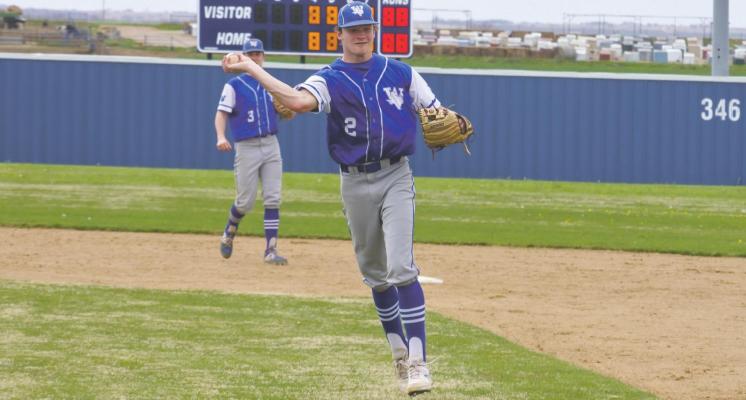 Windthorst second baseman Kyle Wolf throws out a runner at first in the Trojans’ 5-1 loss to Albany on Thursday, March 11. Photo/Will Edwards