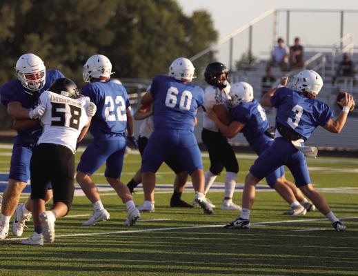 Windthorst Quarterback Brock Belcher lines up a pass during the Trojans scrimmage against the Quanah Indians on Thursday, Aug. 13. Photo/Rolando Medina