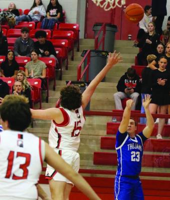 Trojan sharpshooter Brock Belcher nails one of his five three-pointers in the win against the Cubs on Tuesday, Jan. 20. Courtesy photo/Jamie Anderle