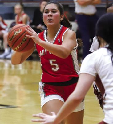 Holliday junior Bella Timms dishes out an assist in the Lady Eagles’ 56-39 win over Vernon. Photo/Will Edwards