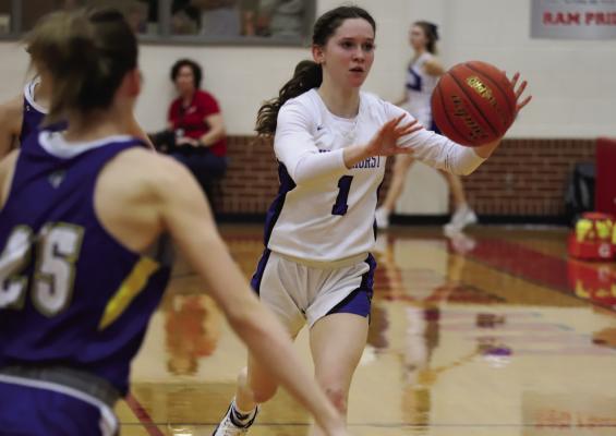 Windthorst senior Bree Kirk makes a pass in the fourth quarter of the Trojanettes 47-30 regional quarterfinal loss to No. 3 Lipan on Tues., Feb. 21, in Mineral Wells. Photo/Will Edwards