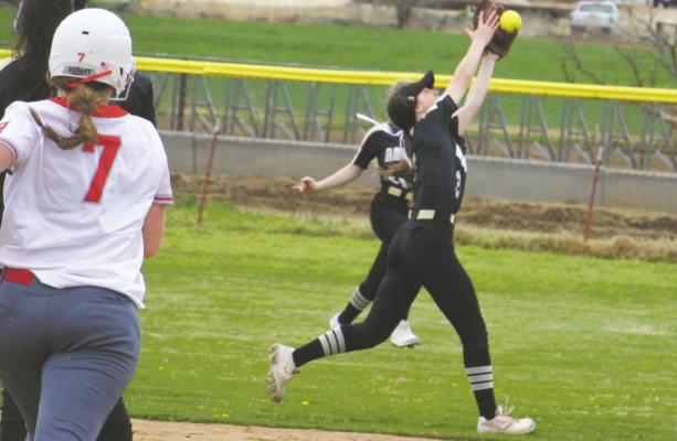 Archer City’s Kadence Huffman pulls down a popup in the Lady Cats’ game against Holliday on Thursday, March 11. Photo/Will Edwards