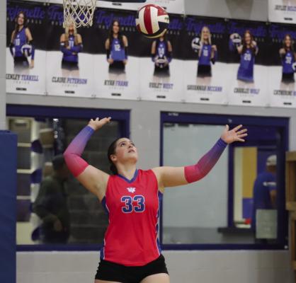 Windthorst junior Heidi Tackett serves up for the Trojanettes in their 3-0 home sweep over Olney on Tuesday, Oct. 7. Photo/Landon Davis