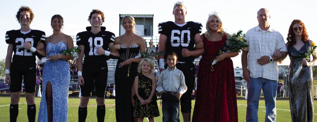 The Archer City Homecoming Court: Tanner Deerinwater escorted Junior Addi Canada, Reegan Deerinwater escorted Senior Serenity Jones, Homecoming King Shooter Canada escorted Homecoming Queen Brooklyn Roberts, junior Autumn Stump was escorted by her step-father. Front:Attendees Evelyn Wuthrich and Elijah Winter. Photo/Nathan Lawson