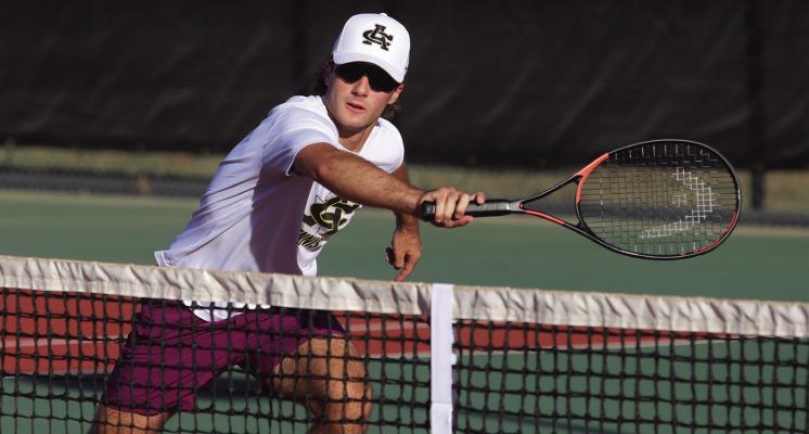 Archer City’s Seth Truette returns a shot at the net at the District 9-2A tennis meet on Thursday, April 2. Truette and fellow sophomore Ashlyn Harvey claimed a silver medal in the Mixed Doubles division.ey claimed a silver medal in the Mixed Doubles division.. Photo/Landon Davis