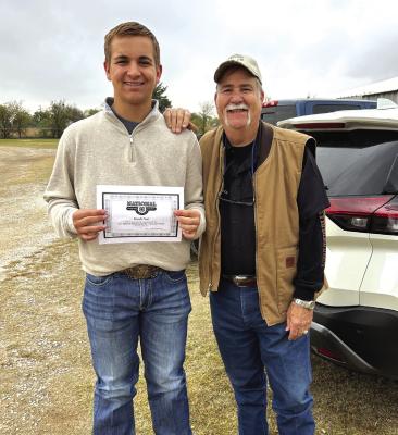 Kreede Neal completed the 4-H shooting sports coaches training this weekend in Archer City. He is now the first youth in the county to be a 4-H Certified Assistant Archery Coach. Pictured: Kreede Neal, 4-H Shooting Sports Ambassador and Lawrence J. (Larry) Perez, Extension Program Specialist and Texas 4-H Shooting Sports Coordinator. Courtesy photo