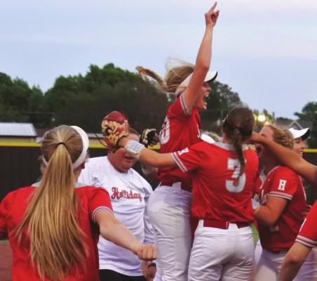 Holliday’s Payton Murray celebrates with her teammates after assisting on the final out of the Lady Eagles’ 7-6 win over Jacksboro. File photo