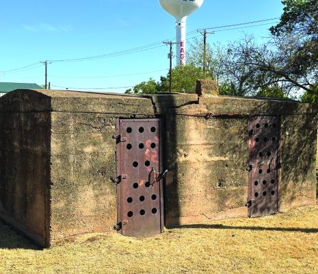 The Old Jail across from the Post Office will remain after the city council approved to keep the building, and will also build a fence around it. Photo/Landon Davis