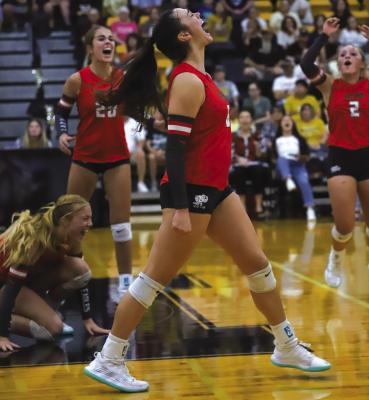 Holliday senior Kenna Wood struts her stuff after putting the Lady Eagles within a point of clinching the match in the fifth set against Henrietta on Tues., Sept. 26. Photo/Will Edwards