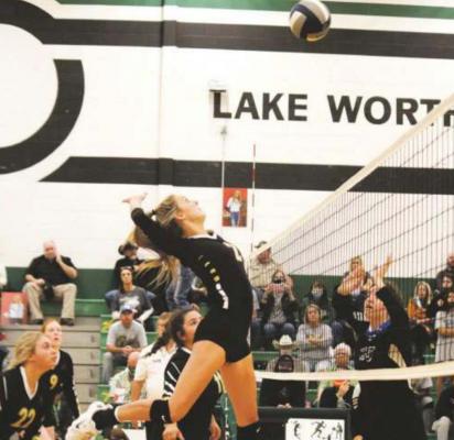 Mallory Maxwell skies up for a kill in the second set against Bosqueville in the area round of the playoffs. Photo/Jenny Schroeder