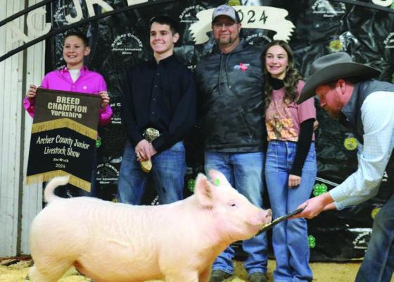 Sam Gilmore poses with his Grand Champion Market Swine Project. Photo/Nathan Lawson