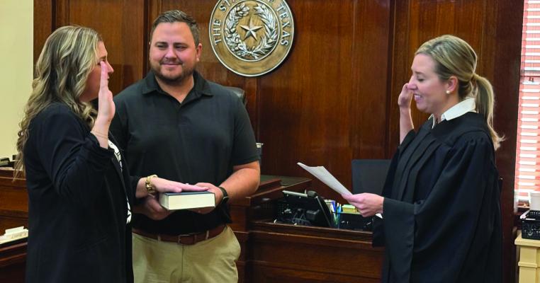 Jordyn Berend (left) was sworn in as the new Archer County Attorney by 97th District Court Judge Trish Coleman Byars in the Archer County Courthouse on Monday, Dec. 2. Courtesy photo