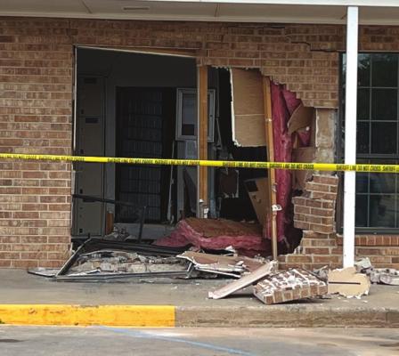 Vehicle drives through Holliday Post Office