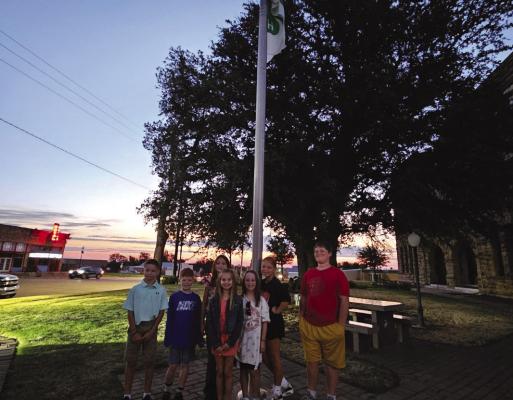 4-H members raised the 4-H flag on the Archer County Courthouse Square the morning of Monday, Oct. 2, in honor of National 4-H Week. Courtesy photo