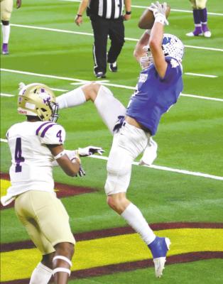Trojans bring down three-time defending champions, Mart, 22-21