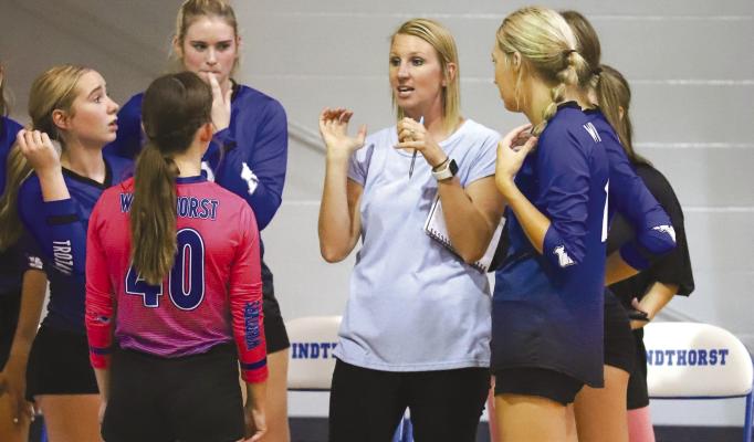 Windthorst Coach Allison Bussey provides some instruction to her team during the Trojanette's 3-0 win over Burkburnett on Tuesday, Aug. 16. Photo/Will Edwards