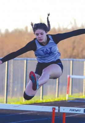 Windthorst's Saige Anderson Clears the final hurdle in the 300 at the District 9-2A track meet on Friday, April 8. Anderson won the event with a time of 49.4 seconds to advance to the area meet. Photo/Will Edwards