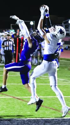 Windthorst's Kolby Teakell rises above a Plowboys defender to snag a Trojan touchdown in their area round loss to Roscoe, 50-22, on Thursday, Nov. 16. Photo/Nathan Lawson