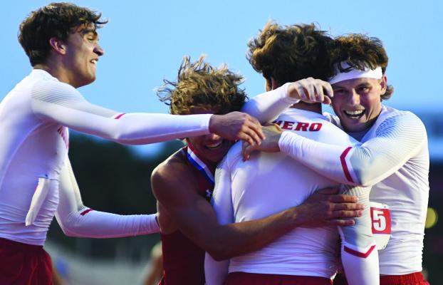 Holliday track members Ty Harrison (left), Noah Strohman (middle), Steele Skinner (middle) and Vaughn Hamill (right) celebrate Skinner's come from behind victory to secure the UIL 3A State Track and Field Championship on Thursday, May 1. File photo