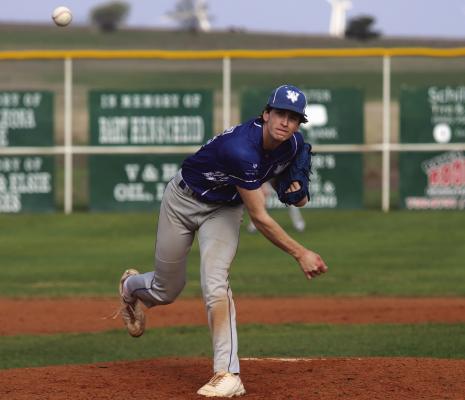Windthorst's Tanner Doyal tosses a pitch in the Trojans' 4-3 loss to Muenster on Thursday, March 14. Photo/Landon