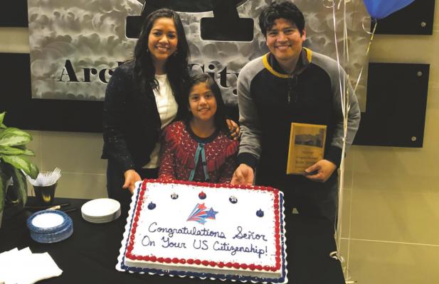 Archer City High School’s Spanish teacher Ruben Martinez, known as “Señor,” poses with his family in the foyer of the auditorium following the high school awards ceremony during which he received a special plaque honoring his achievement of U.S. citizenship in January of 2020. Photo/Jenny Schroeder