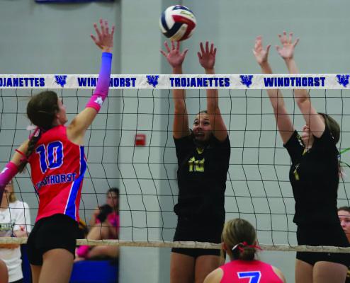 Frontline players Millie Mayo and Jocelyn Tedrow attempt to block a hit by Windthorst’s Kenley Teakell in their matchup on Tuesday, Oct. 22. Photo/Landon Davis