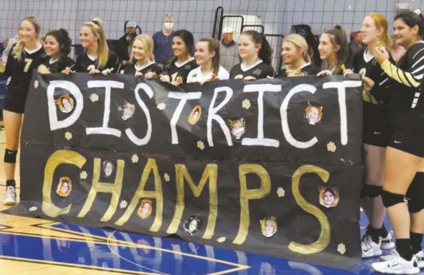 Archer City celebrates the District 9-2A championship following the Lady Cats’ 3-1 win over the Trojanettes on Saturday, Oct. 24. Photo/Will Edwards