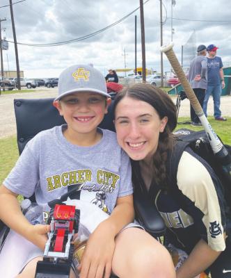 Kalan Stephens takes a photo with his sister Kadence Huffman