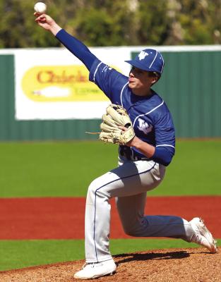 Windthorst’s Kasen Wiles breaks off a curve ball in the Trojans’ 14-9 win over Anson on Friday, March 9, at Hoskins Field. Photo/Will Edwards