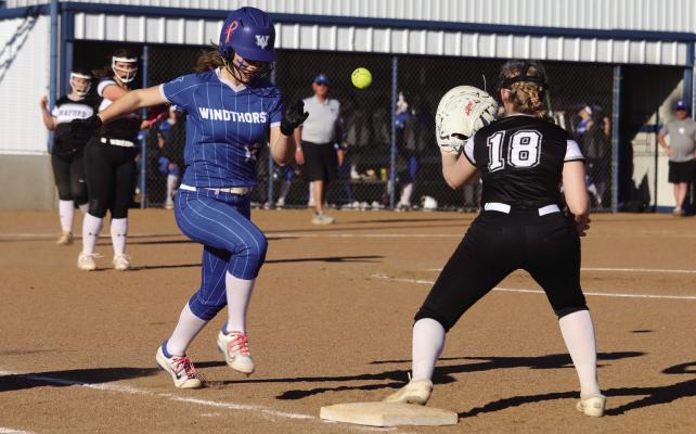 Trojanette centerfielder Chloe Schroeder beats the throw to first in Windthorst’s first home game versus the Graford Lady Rabbits on Monday, Feb. 24. Photo/Landon