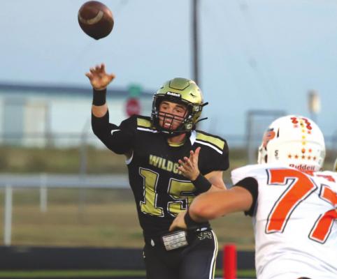 Archer City quarterback Ty Bates throws a pass in the first quarter of the Wildcats’ 40-19 homecoming loss to Petrolia on Friday, Oct. 1. Photo/Will Edwards
