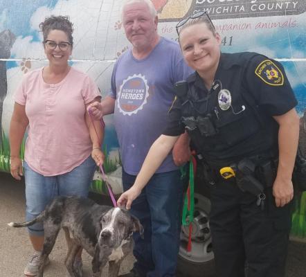 ACPD reserve officer Autumn Weber (right) turns over a dog from animal cruelty case to the Wichita County Humane Society. Courtesy photo/ACPD
