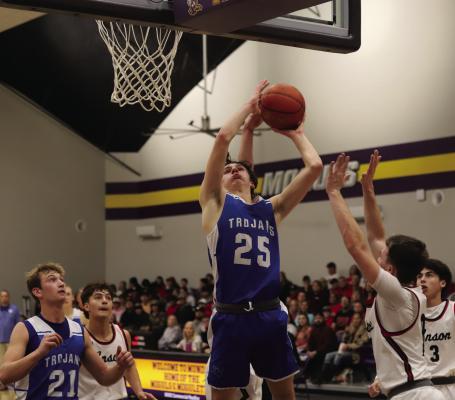 Trojan sophomore Avery Schroeder puts in a contested layup in Windthorst’s 58-50 Bi-District round win over Anson on Monday, Feb. 17. Photo/Landon Davis