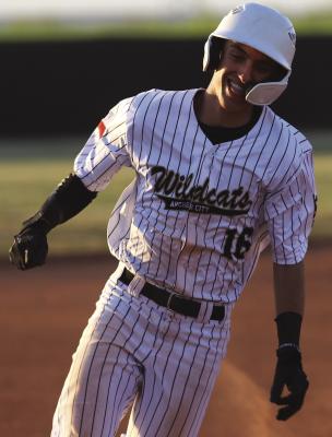 Archer City sophomore Reed Truette smiles as he rounds third in the Wildcats’ 23-1 win over Electra o Tuesday, March 24. Photo/Landon Davis