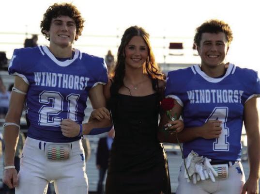 Being escorted by seniors Daxton Anderson and Conner Schreiber, senior Violet West was named Windthorst Homecoming Queen before the game on Friday. Courtesy photo/Jamie Anderle