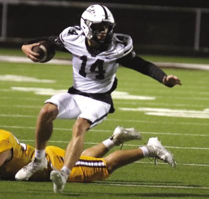 Archer City's Laine Hall fights for yards in the Wildcats 62-0 loss to No.4 Collinsiville on Thursday, Nov. 9, in Bridgeport. Photo/Jerry Phillips
