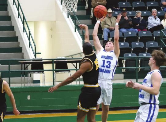 Windthorst’s Cooper Wolf shoots over a Cisco defender in the Trojans’ 58-33 bi-district loss on Tuesday, Feb. 22, in Breckenridge. Photo/Jerry Phillips