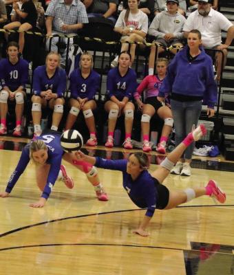 Senior Isabel Bussey makes a diving save in the Trojanettes’ volleyball game versus the Archer City Lady Cats on Saturday, Oct. 5. Courtesy photo/Jamie Anderle