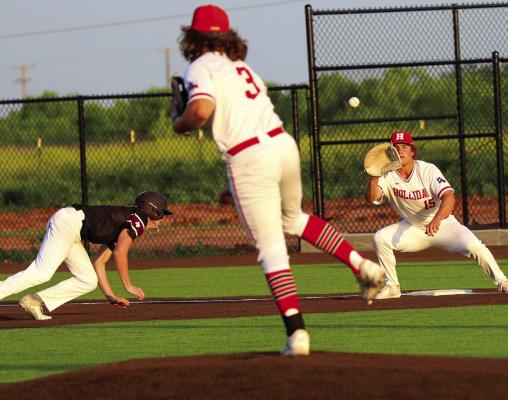 Holliday pitcher Michael Stewart picks off a Bowie baserunner at firstbase as Cooper Turner applies the tag on Wednesday, April 17. Photo/Will Edwards
