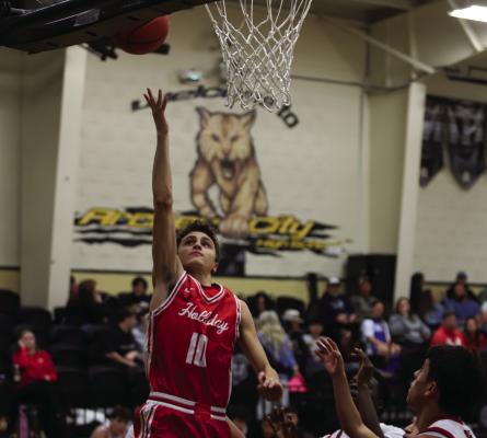 Holliday forward Hudson Dray goes for a layup against Wellington in the annual Wildcat Classic on Friday, Dec. 5. Photo/Landon Davis