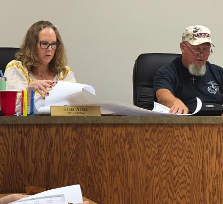 Holliday City Secretary Gerri Ayers and Councilman Chad Laffan review a replat request during the council meeting on Monday, Sept. 12. Photos/Callie Lawson