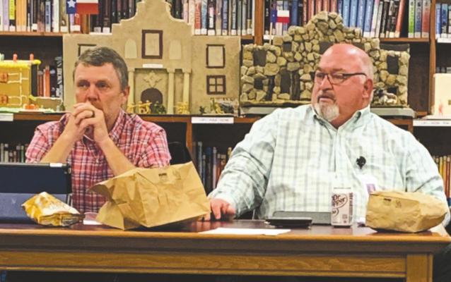 Windthorst School Board President Chad Steinberger (left) and Superintendent Lonnie Hise look on during the board meeting Monday, March 8. Photo/Nathan Lawson