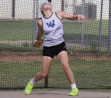Trojanette thrower Gabby Hoegger slings the discus at the Panther Pride Relays in Seymour on Thursday, March 27. Photo/Landon Davis
