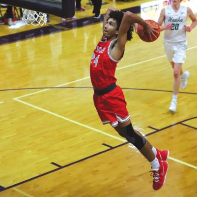 Holliday’s Nathan Williams throws down a monster two-handed slam midway through the third quarter in the Eagles’ 64-51 area round win over Wall. Photo/Will Edwards