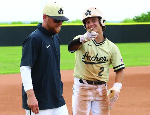 Wildcat Head Coach Collin White and Pitcher Isaac Dieguez celebrate after Dieguez' 3 RBI triple in Archer City's 13-2 win over Electra. Photo/Nathan Lawson