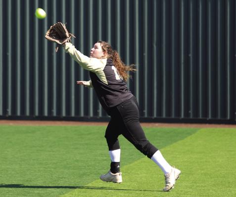 Archer City senior Alyssa Schroeder makes the flyball grab in right field in the Lady Cats’ Saturday matchup with the Lady Rabbits. Photo/Landon Davis