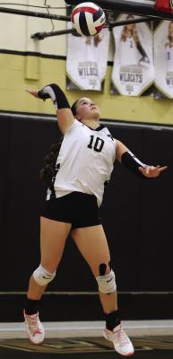 Archer City setter Millie Mayo springs for her serve against Windthorst on Friday. Photo/Landon Davis