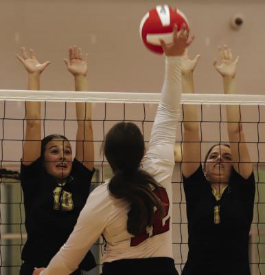 Freshman Millie Mayo and sophomore Jocelyn Tedrow go for the block in their 3-0 sweep over the Olney Lady Cubs on Tuesday, Oct. 1. Photo/Landon Davis